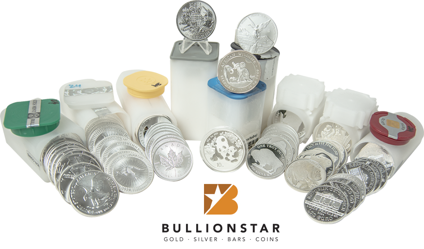 Collection of silver bullion coins in tubes and loose stacks, including designs like the Canadian Maple Leaf and American Eagle, displayed with BullionStar branding.