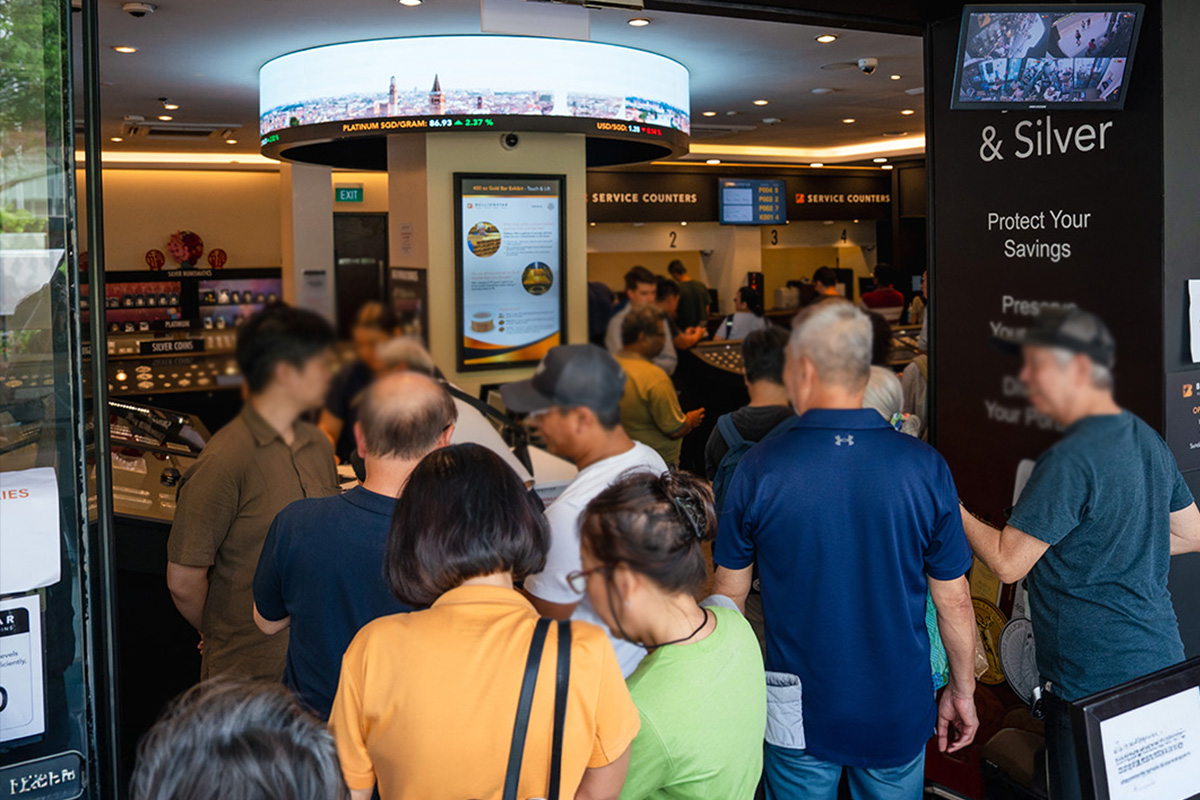 Crowd of customers gathered at the BullionStar Singapore shop counters buying gold and silver