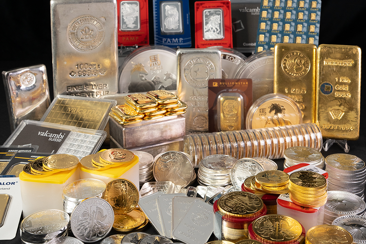 Large assortment of gold and silver bullion bars and coins from refiners including PAMP, Valcambi, Metalor, Perth Mint, and BullionStar