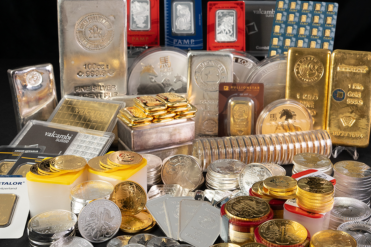 Large assortment of gold and silver bullion bars and coins from refiners including PAMP, Valcambi, Metalor, Perth Mint, and BullionStar