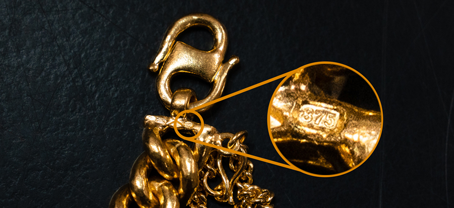 A close-up of a 375 gold stamp.