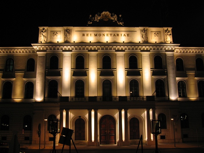 The Austrian Mint building at night.